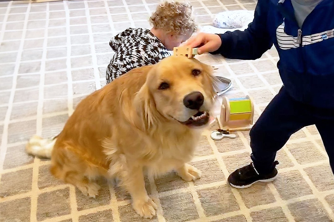 Winnie at play with children in the nursery