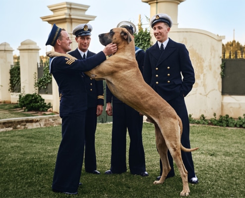 Just Nuisance, the Navy dog with four members of the Royal Navy