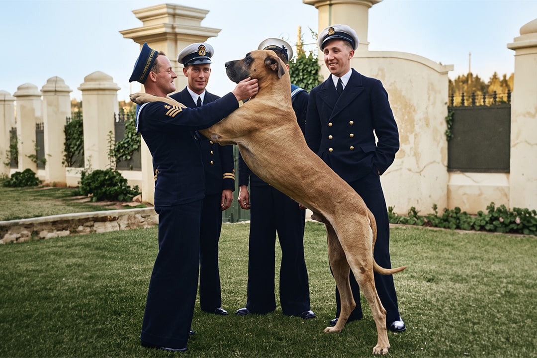 Just Nuisance, the Navy dog with four members of the Royal Navy